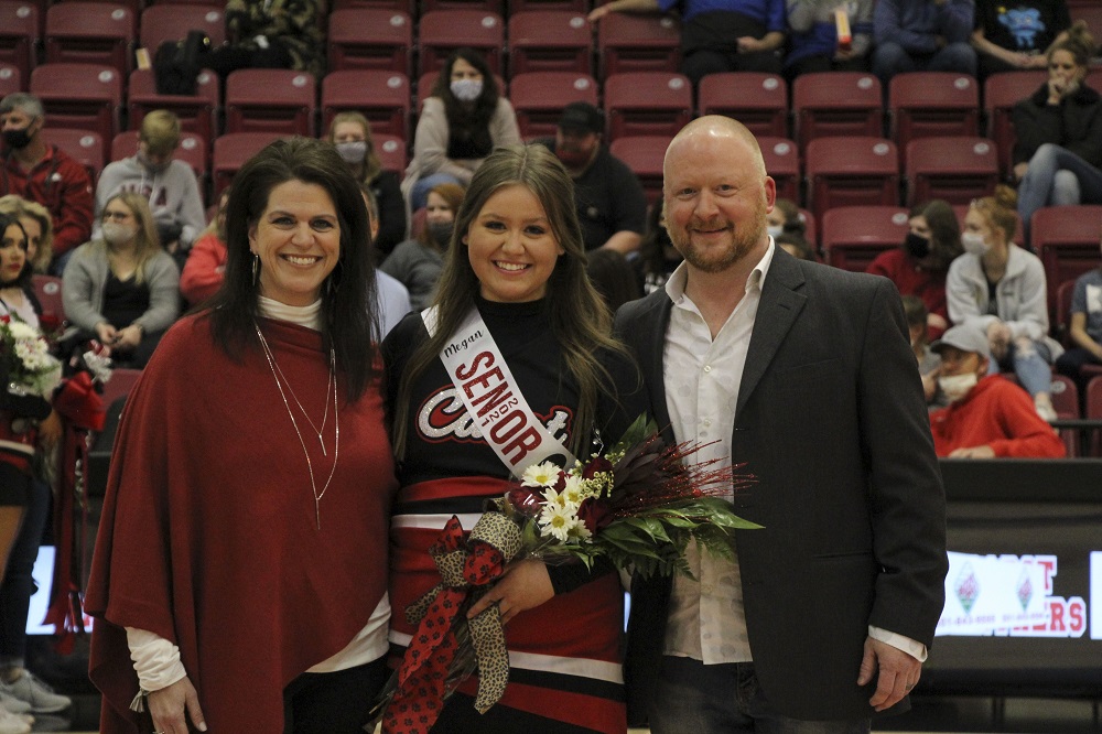 Dance Team senior with parents being recognized for senior night 2021